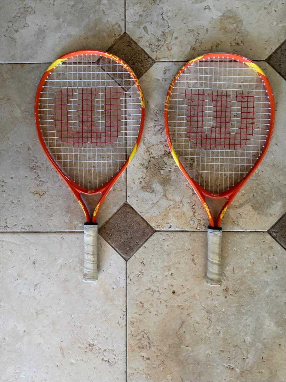 Wilson kids tennis racket 21”. Orange and Yellow Tennis Racket Duo